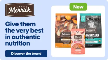 Merrick advertisement banner featuring a range of dog food bags labeled “New,” alongside a dog eating from a bowl in a kitchen. Text reads: “Give them the very best in authentic nutrition.” Button: “Discover the brand.”
